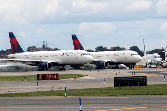 Delta airplanes pictured at LaGuardia Airport.